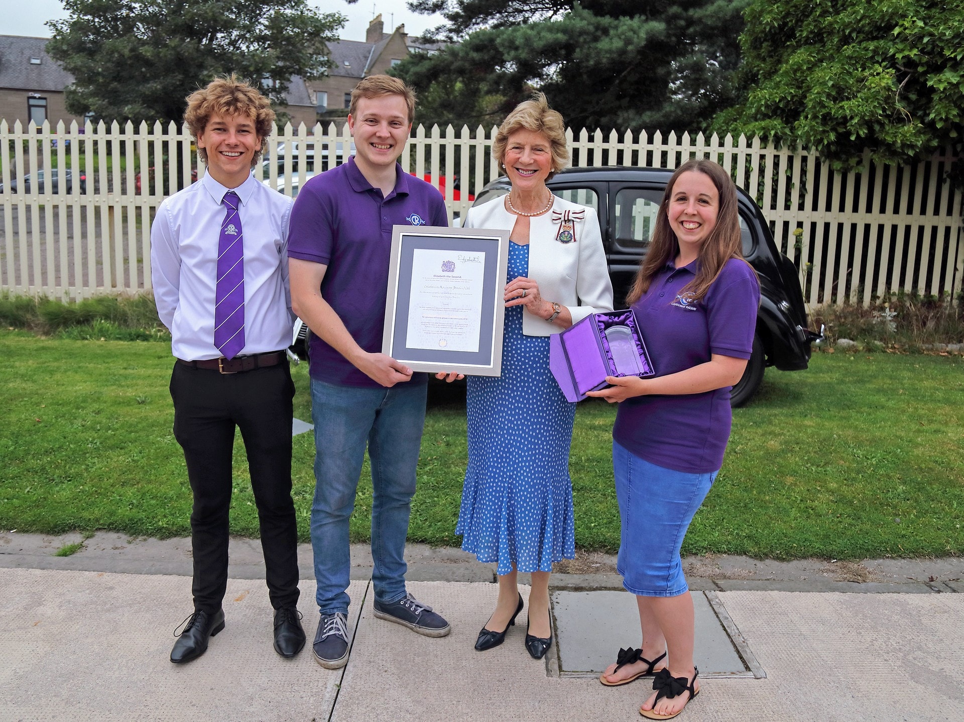 Volunteers being presented with the Queen's Award for Voluntary Service by the Lord Lieutenant of Angus in July 2019.
